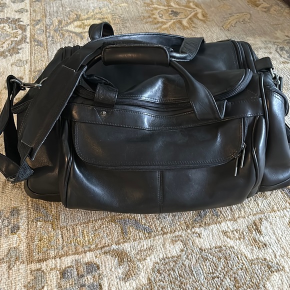 Tumi Bags Excellent Condition Barely Used Black Leather Carry On